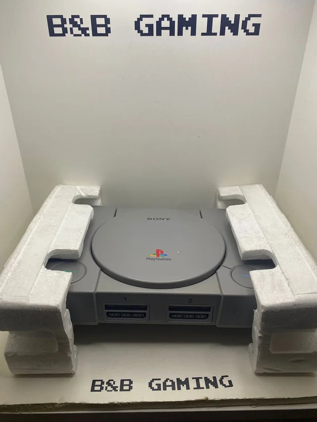 Consola PS1 con Caja y Corchos