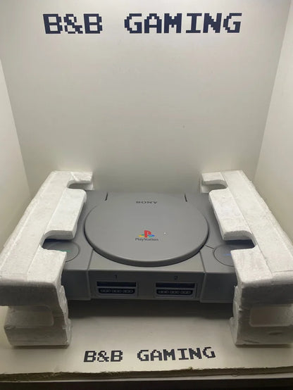 Consola PS1 con Caja y Corchos